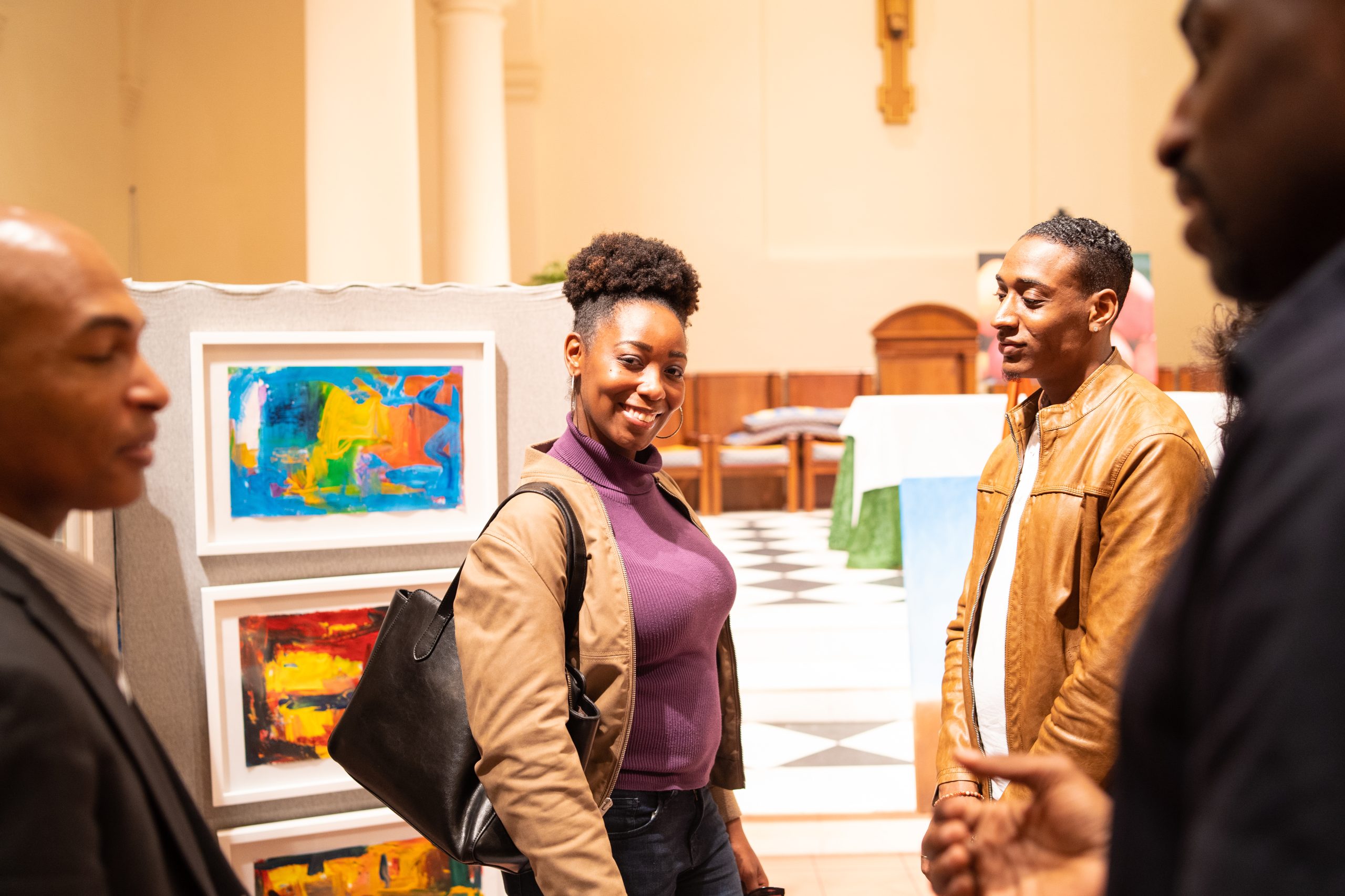 Guests viewing work at a Sizzle Arts photography and art exhibition
